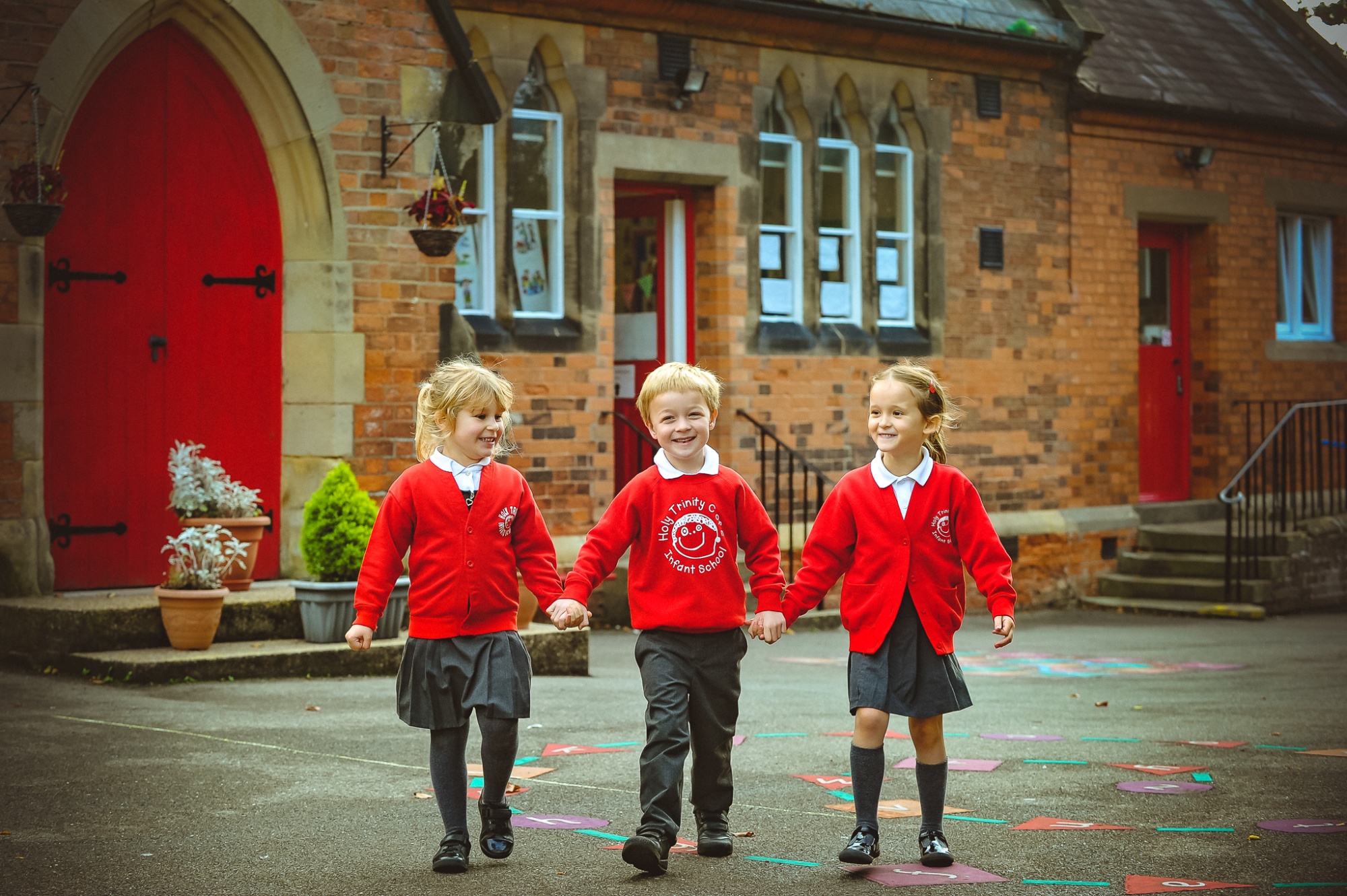 Three students in school playground