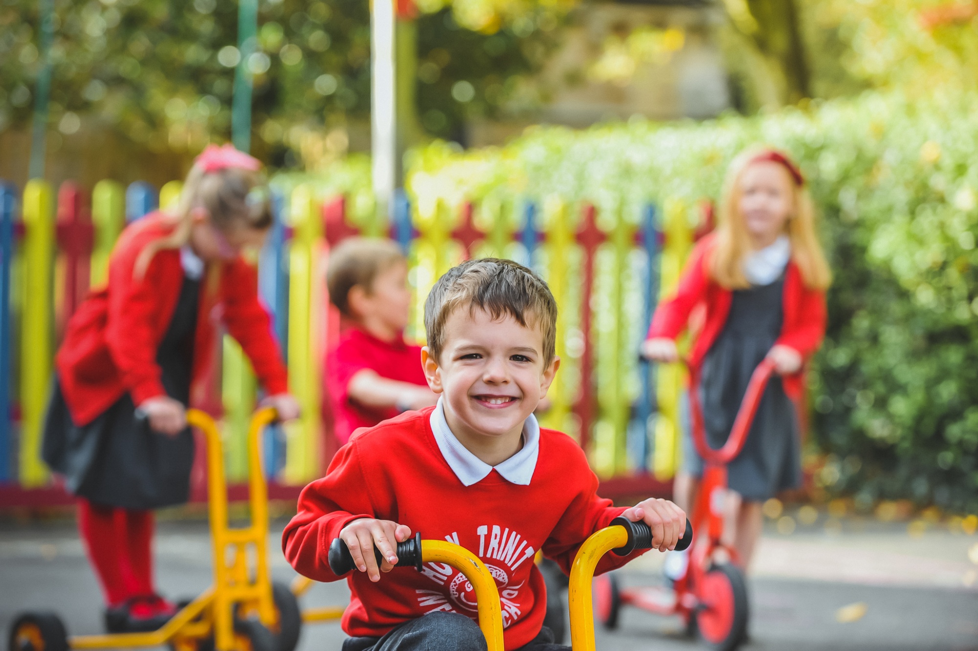 Students on bikes in playground