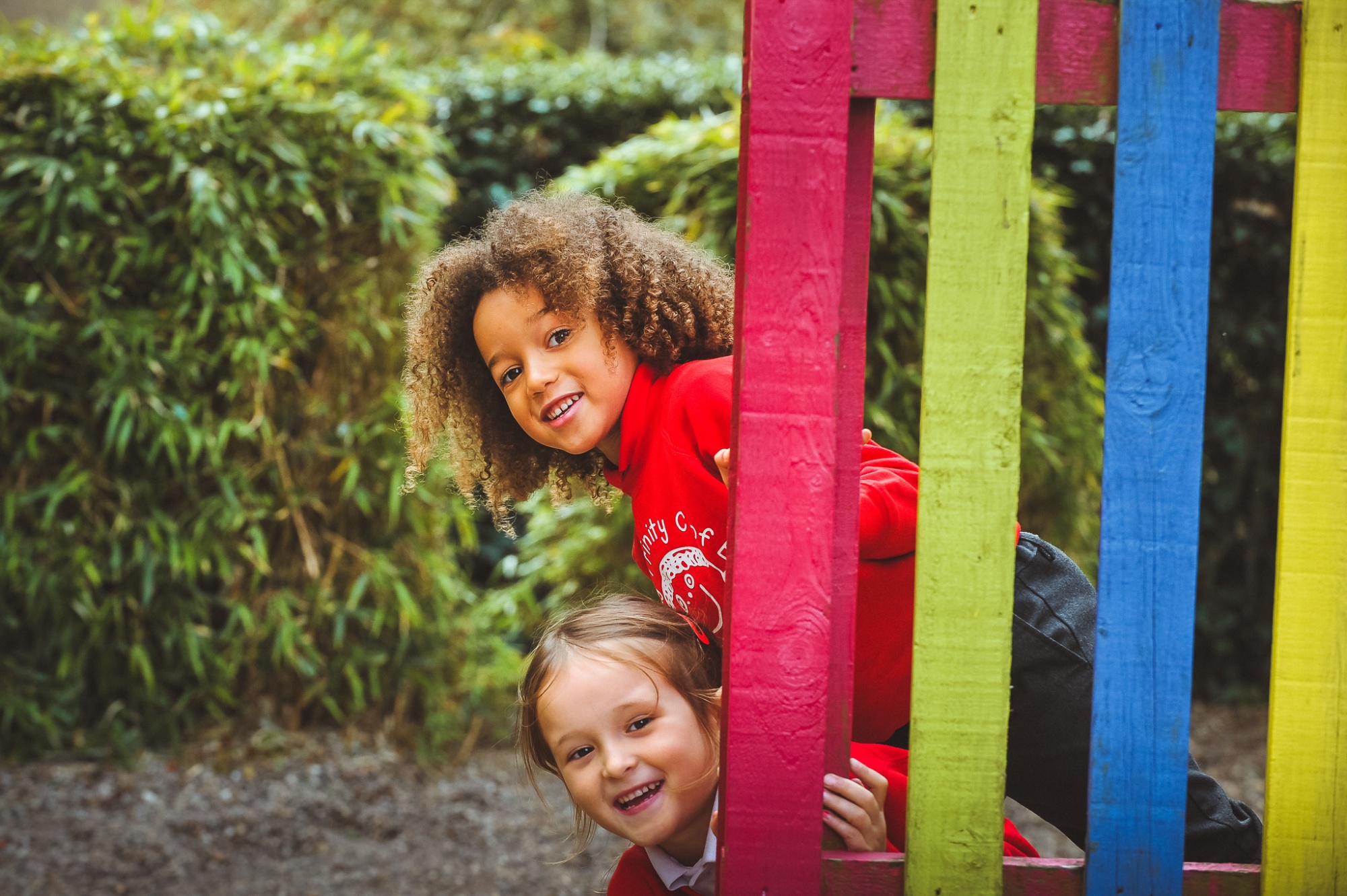 Two children in playground having fun
